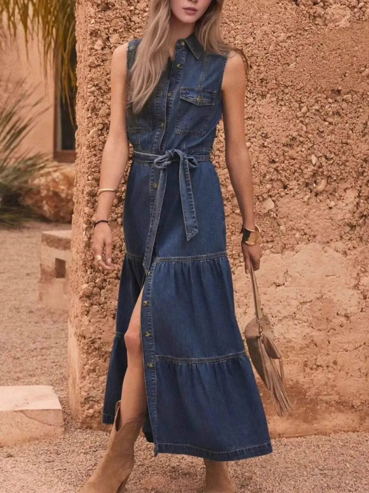 Button-front sleeveless denim dress with tiered layers and belt by Plush Fashion Hub, styled for casual summer wear.