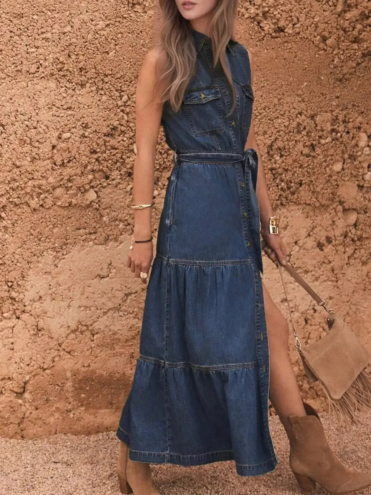 Tiered sleeveless denim dress with button front and belt by Plush Fashion Hub, featuring a casual, stylish design.