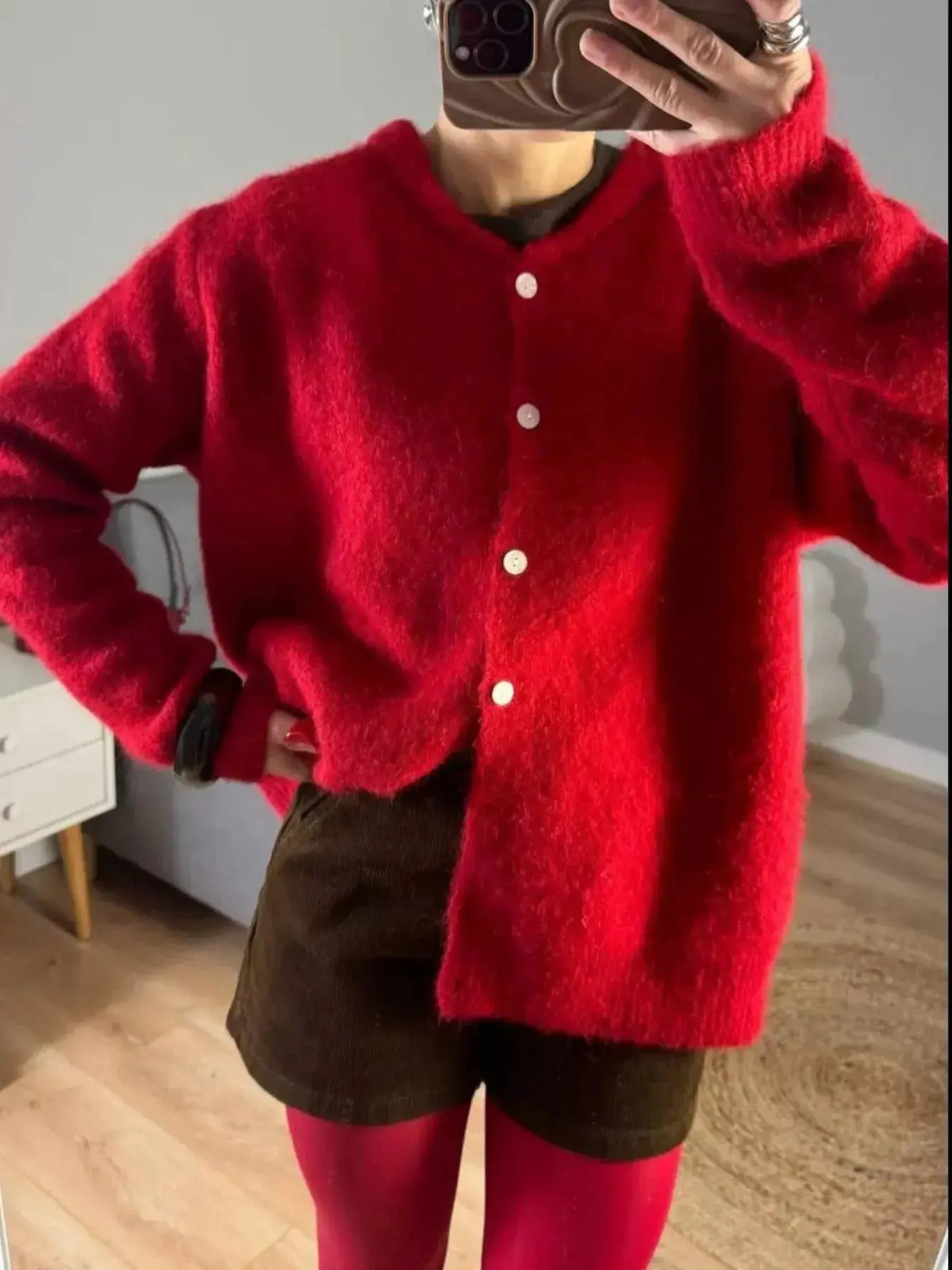 Soft knit long sleeve button-up cardigan by Plush Fashion Hub, perfect for layering and casual wear.