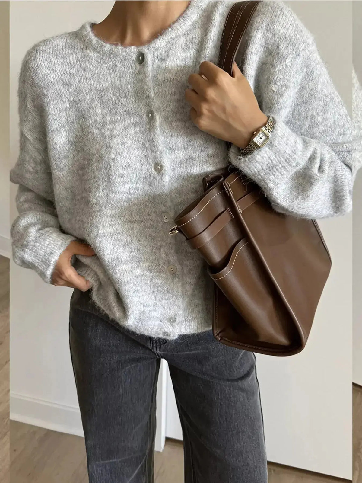 Soft knit long sleeve button-up cardigan sweater by Plush Fashion Hub, ideal for layering and casual wear.