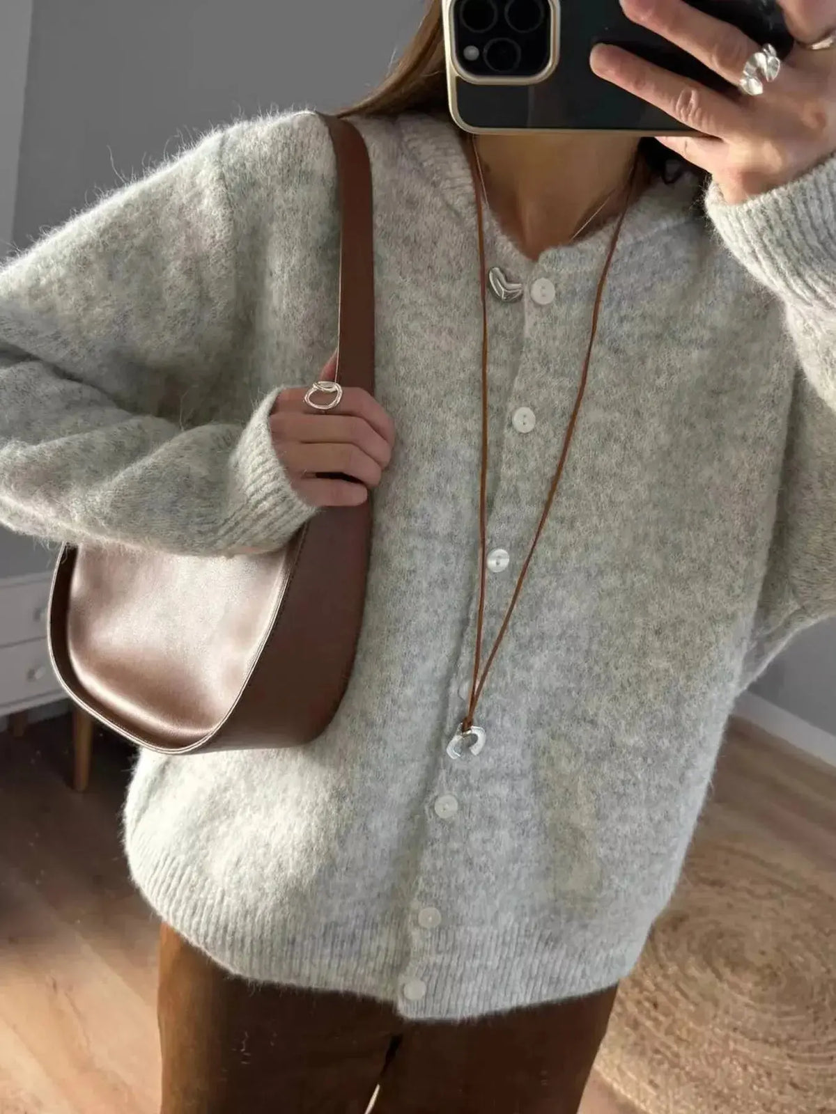 Soft knit long sleeve cardigan by Plush Fashion Hub featuring classic button-up design, perfect for layering and casual wear.