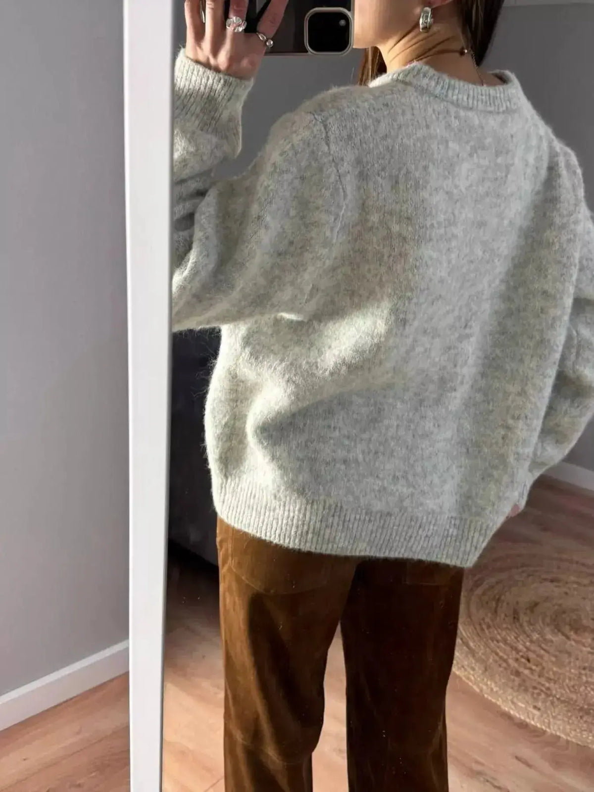 Soft knit long sleeve button-up cardigan by Plush Fashion Hub, perfect for layering and casual stylish wear.