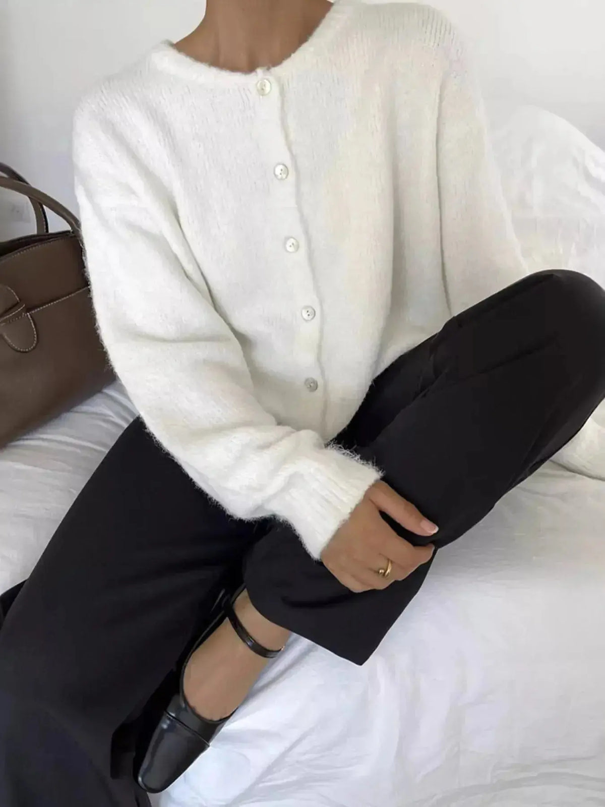 Soft knit long sleeve cardigan by Plush Fashion Hub featuring buttons and a classic button-up design for layered style.