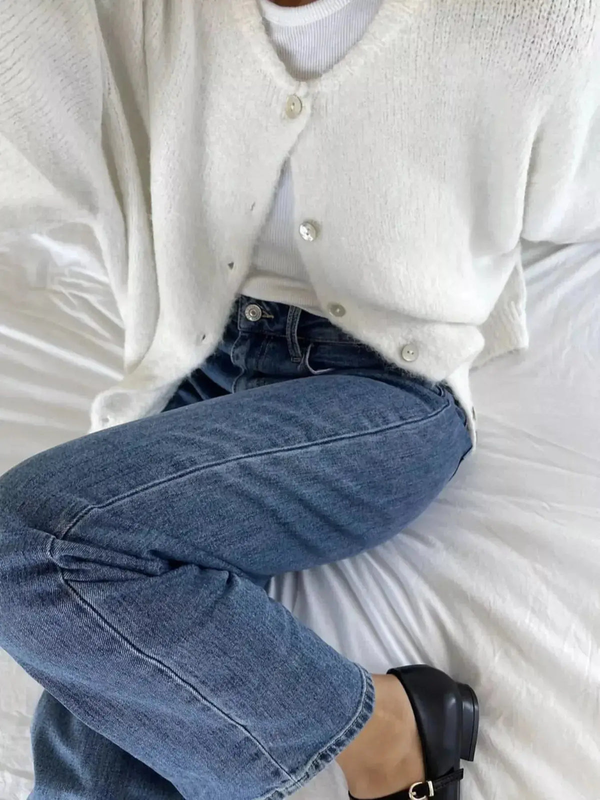 Soft knit plush fashion hub long sleeve button-up cardigan sweater, ideal for layering and casual wear.