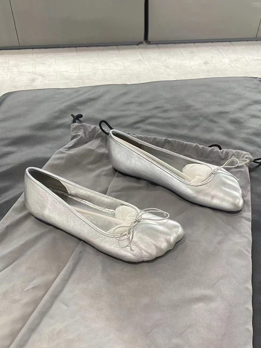 Black and silver round toe slip-on loafers by Plush Fashion Hub, featuring a sleek design and polished finish.