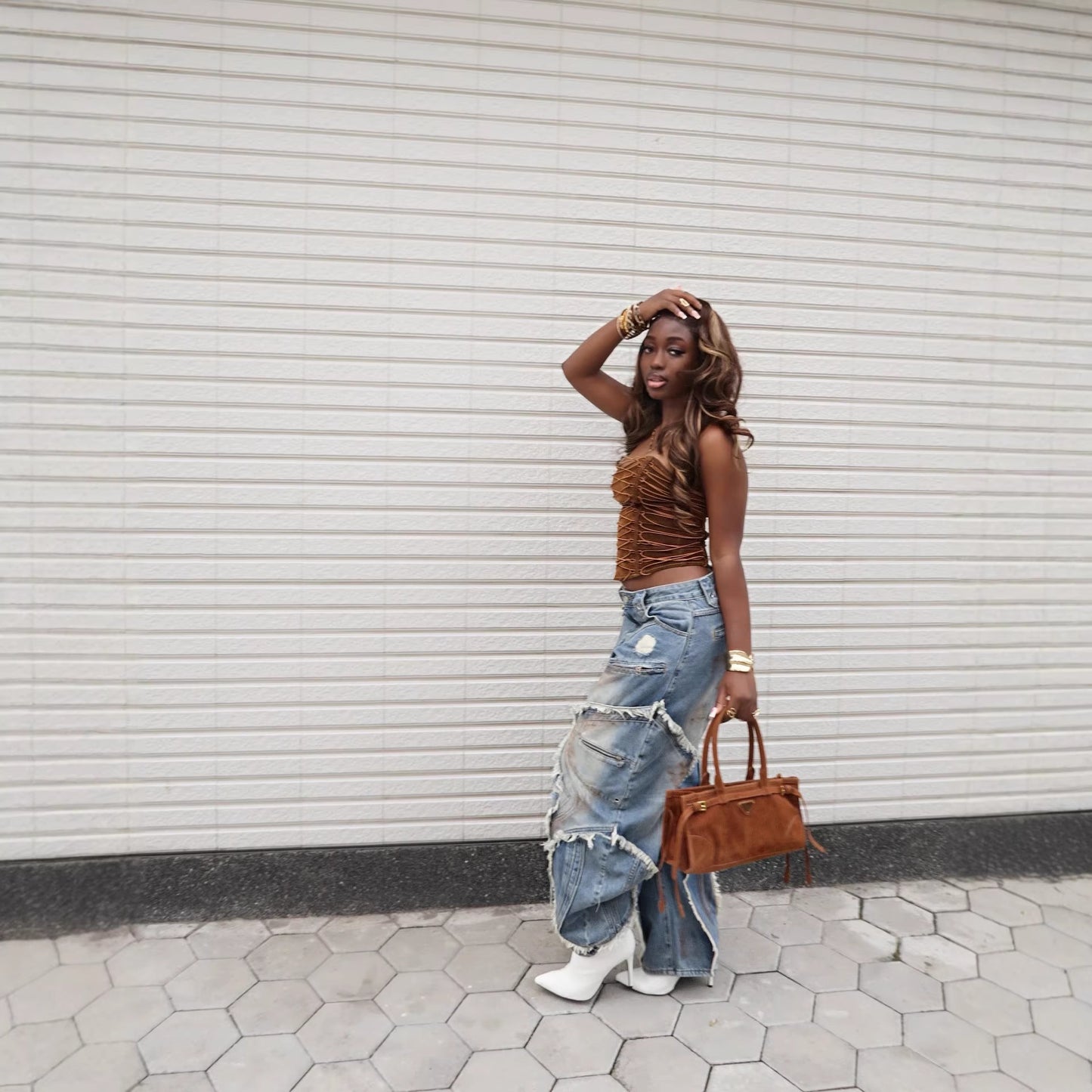 Eprolo wave frayed ripped edge denim jeans featuring distressed details and classic blue denim fabric.