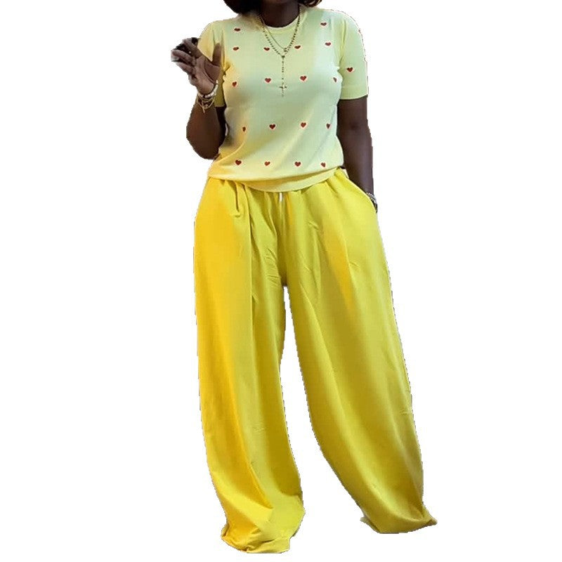 Heart print round neck top and wide-leg pants set by eprolo, featuring a stylish matching outfit with a heart pattern.