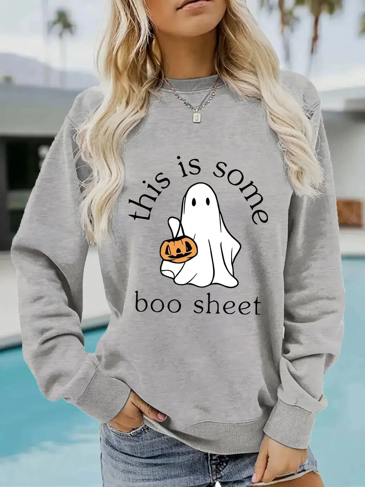 Plush Fashion Hub Halloween graphic hoodie with Boo sheet design, cozy cotton blend fleece, long sleeves, round neck.