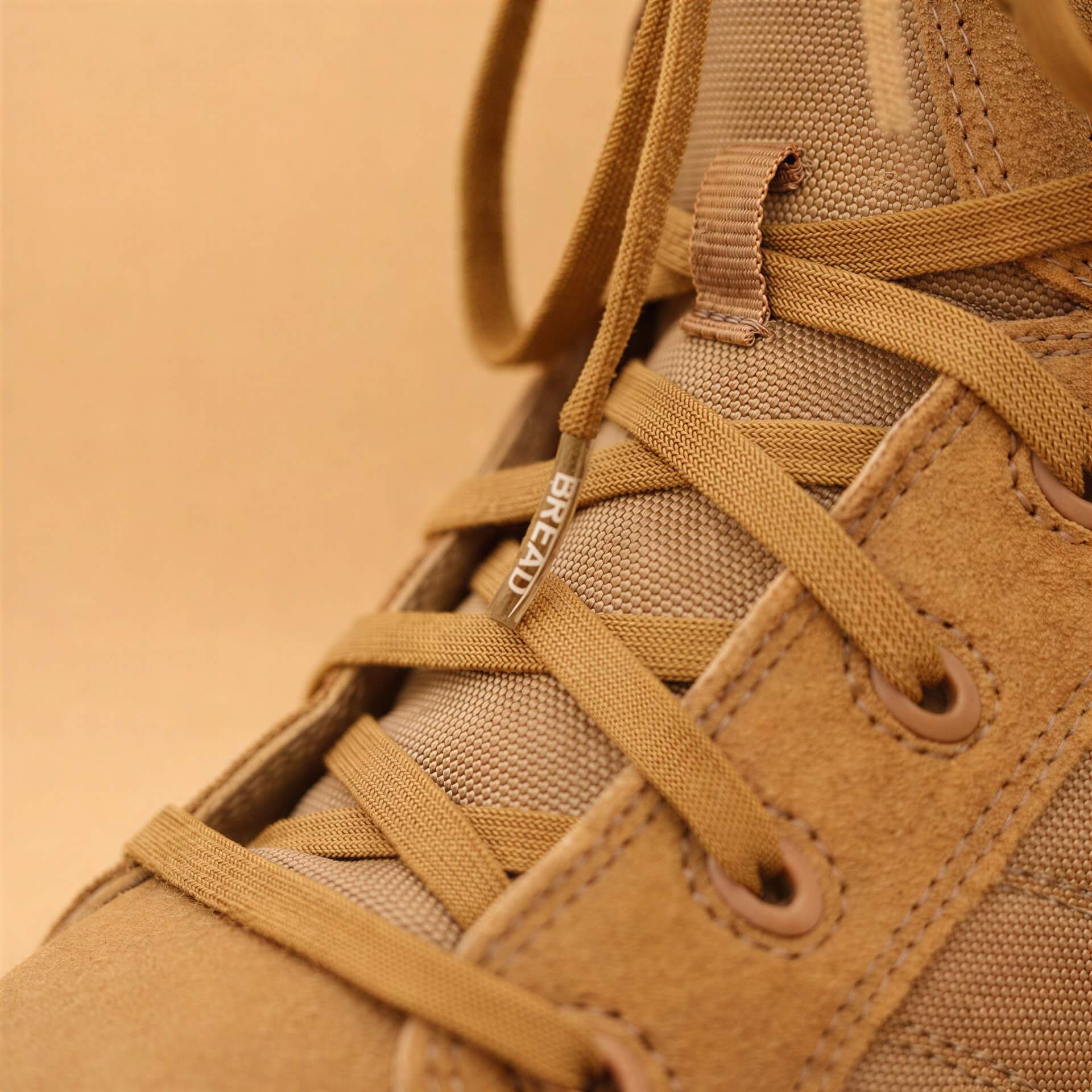 Coyote brown elastic shoelace by Bread, showing close-up of flexible, durable laces designed for comfortable shoe fit.