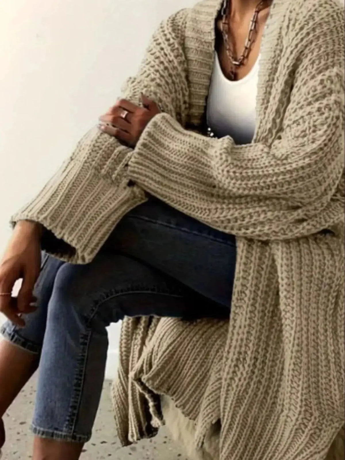 Women's chunky knit open-front cardigan sweater with long sleeves from Plush Fashion Hub, featuring a cozy, oversized design.