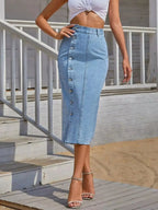 Women’s classic button-front stretch denim skirt with a fitted silhouette and front pockets, by Trendsi.