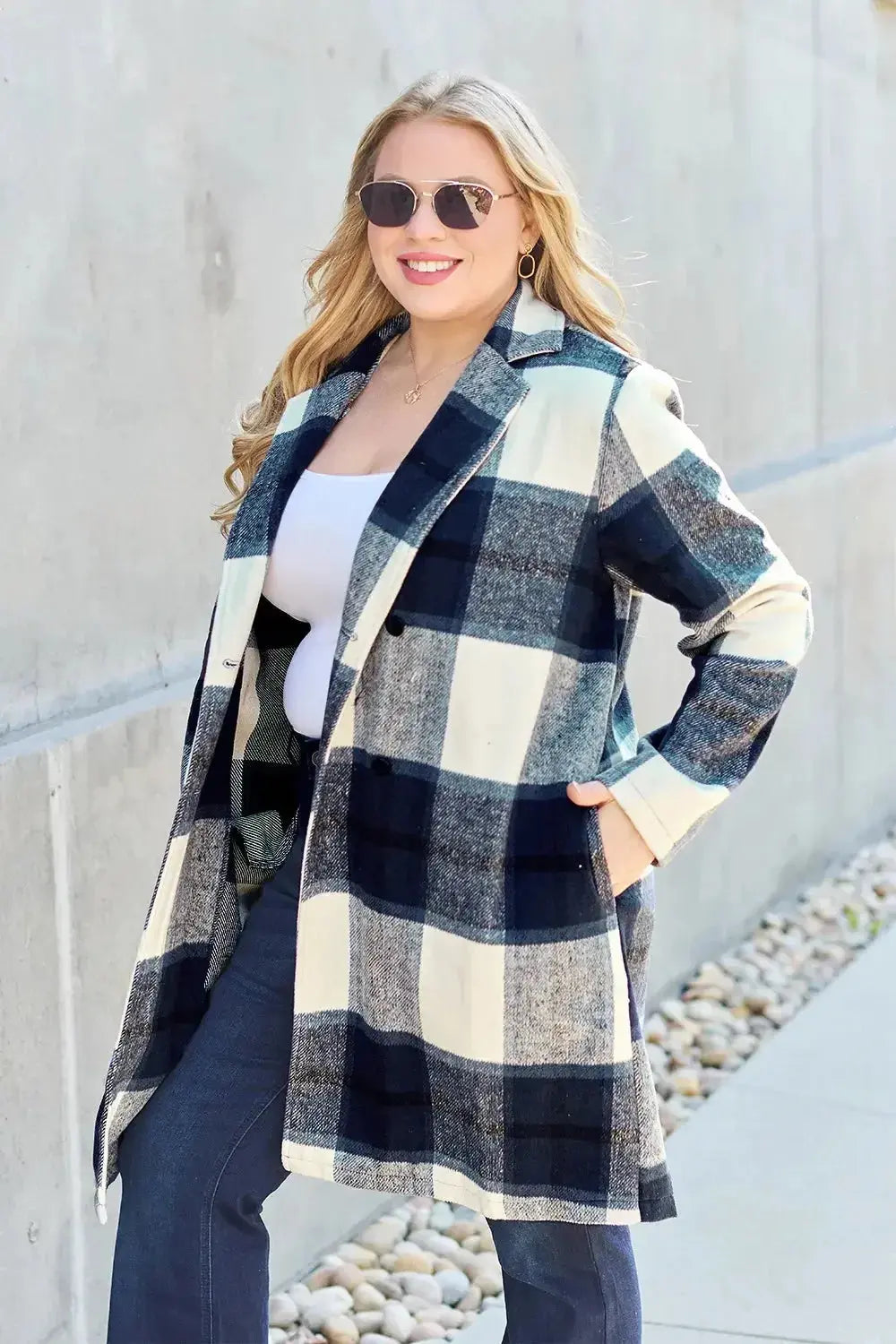 Women's plaid button-up lapel coat by Plush Fashion Hub, seasonal wool-feel outerwear with classic plaid pattern and tailored design.