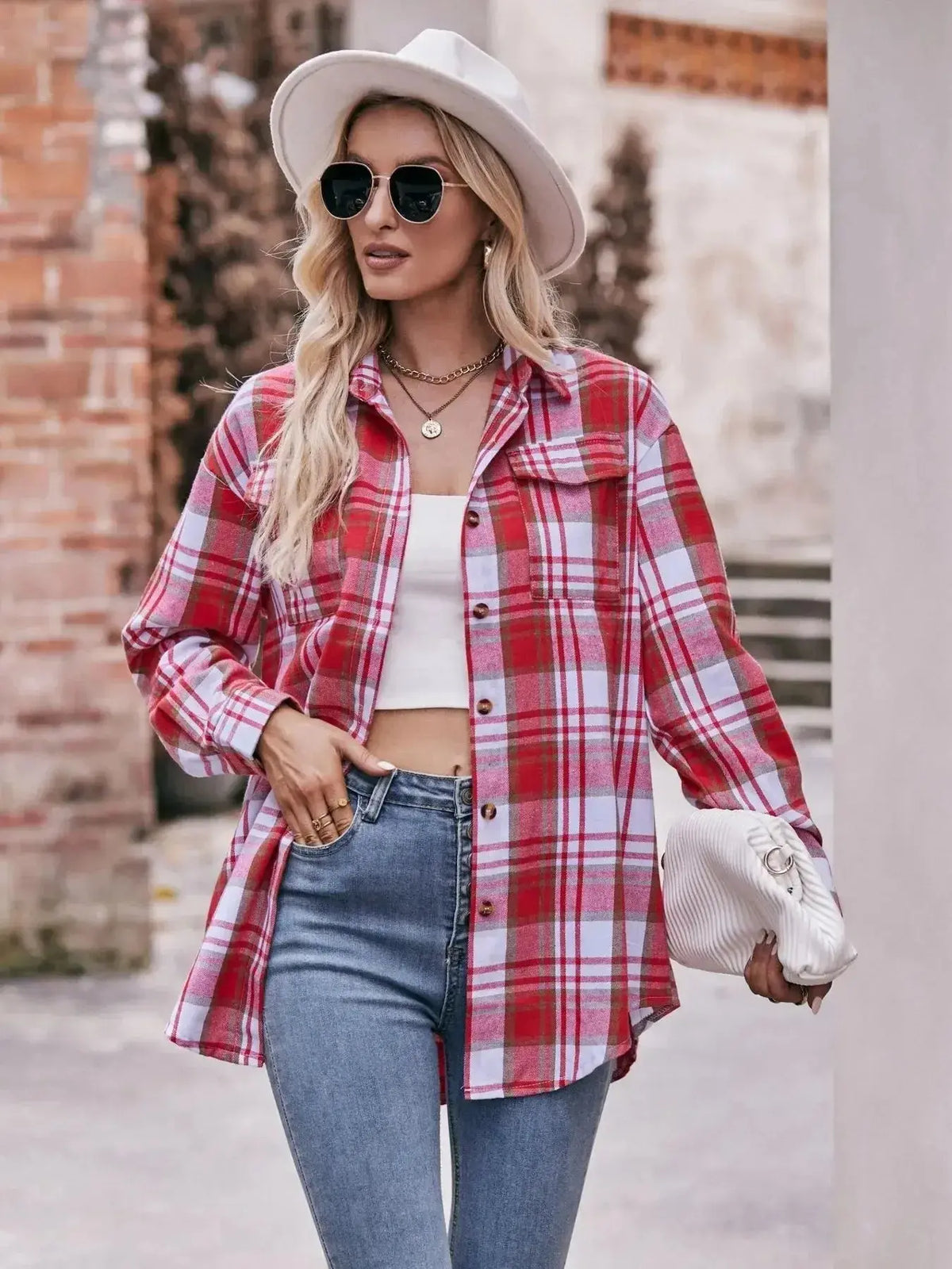 Women's plaid long sleeve button-down shirt by Plush Fashion Hub, featuring classic pattern and casual fit.