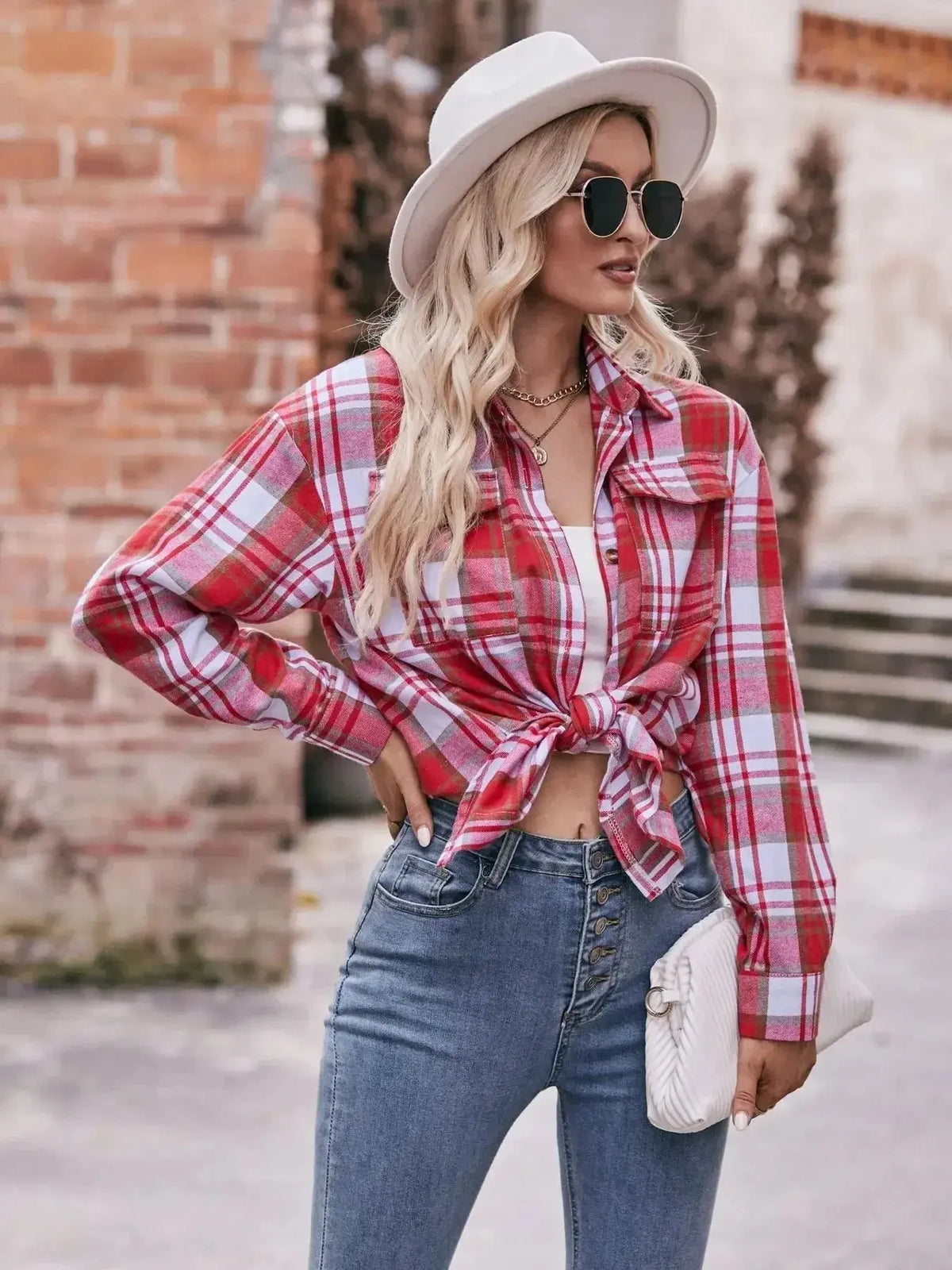 Women’s plaid long sleeve button-down shirt by Plush Fashion Hub, featuring a classic checkered pattern and tailored fit.
