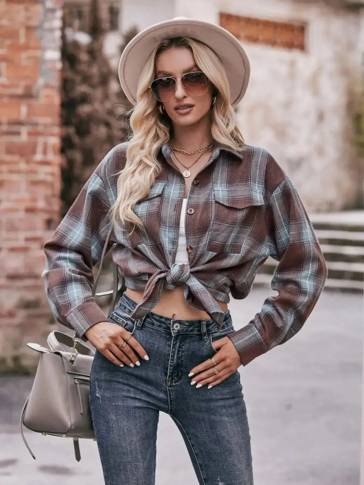 Plaid long sleeve button-down shirt for women by Plush Fashion Hub, featuring classic pattern and casual fit.