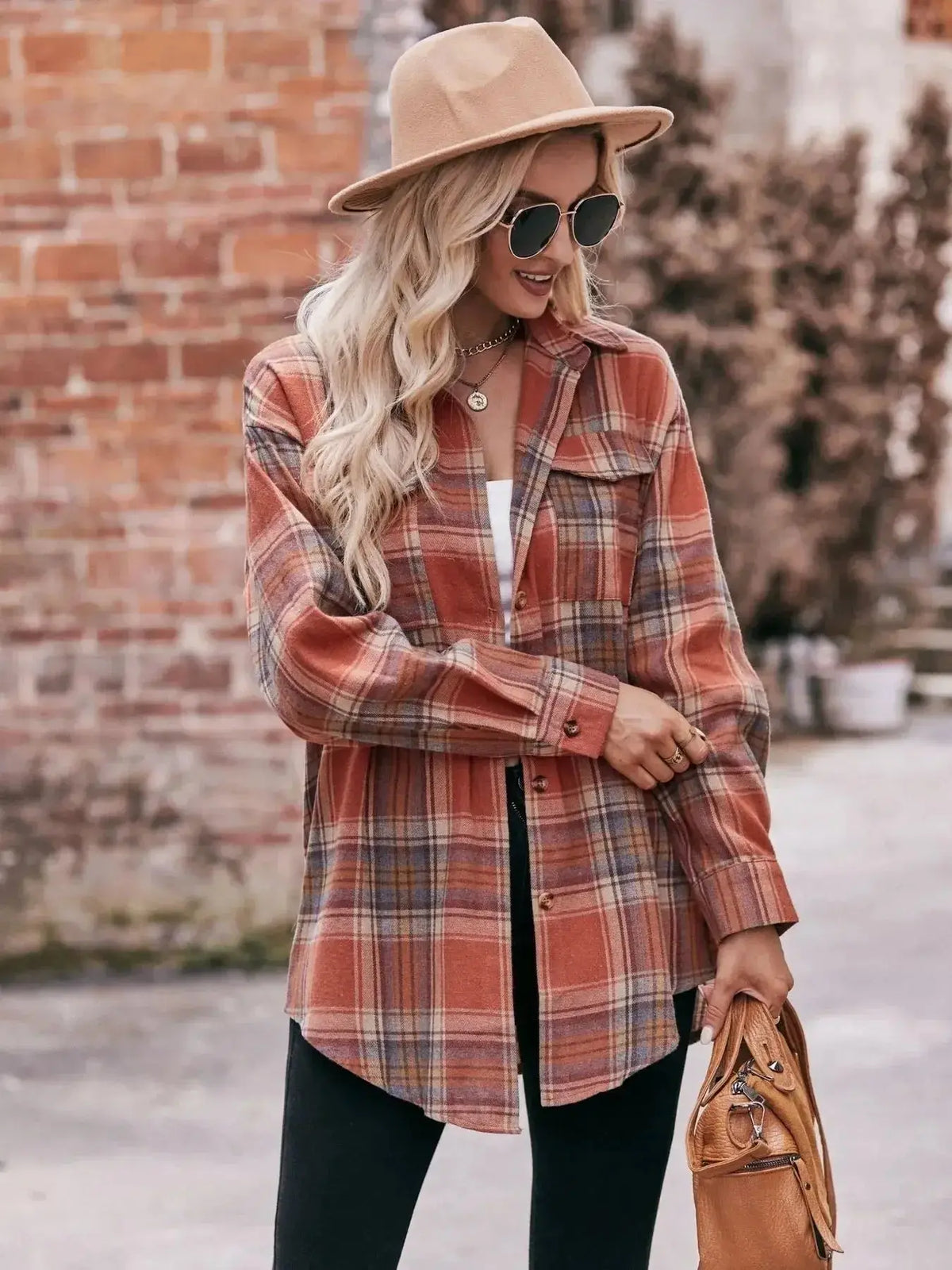 Women’s classic plaid long sleeve button-down shirt by Plush Fashion Hub, featuring a stylish and versatile design.