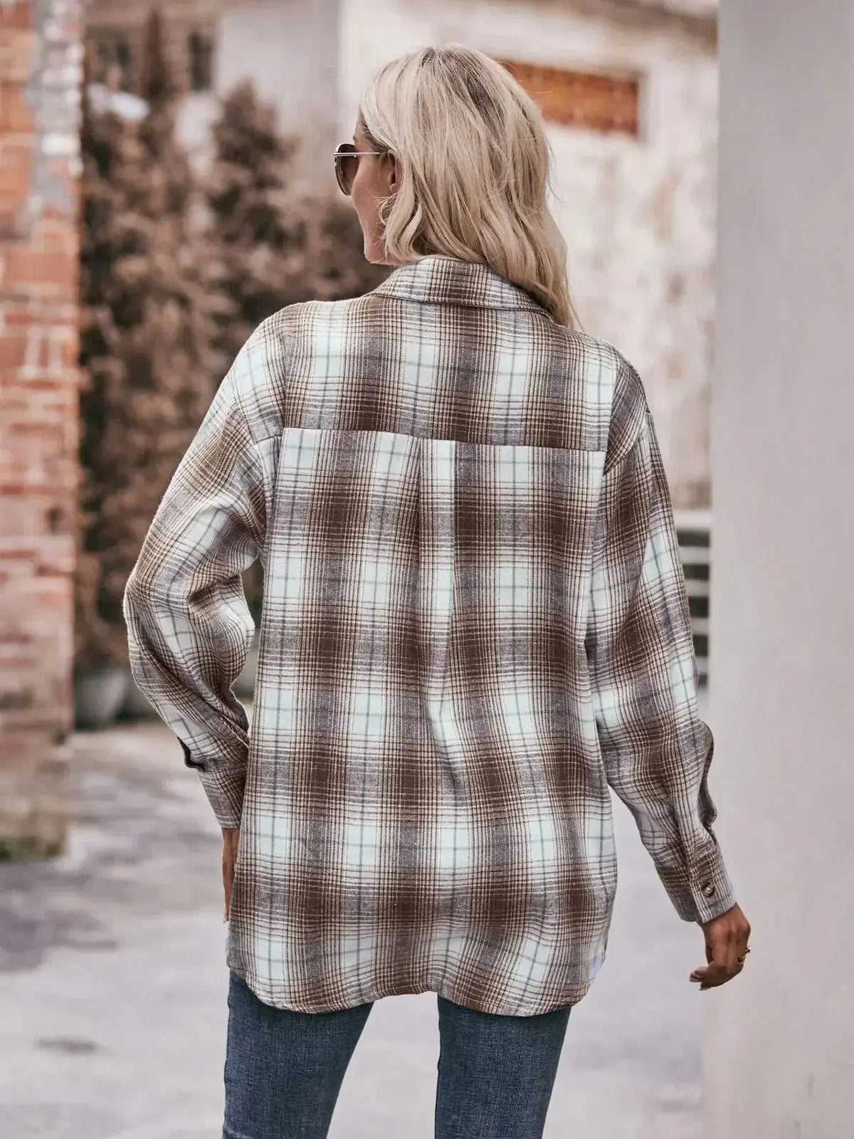 Women's classic plaid long sleeve button-down shirt by Plush Fashion Hub, featuring a timeless pattern and casual fit.