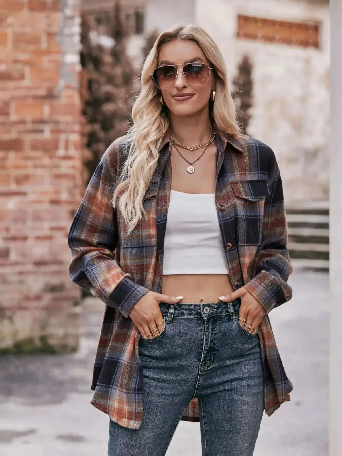 Plaid long sleeve button-down shirt for women by Plush Fashion Hub, featuring a classic pattern and tailored fit.