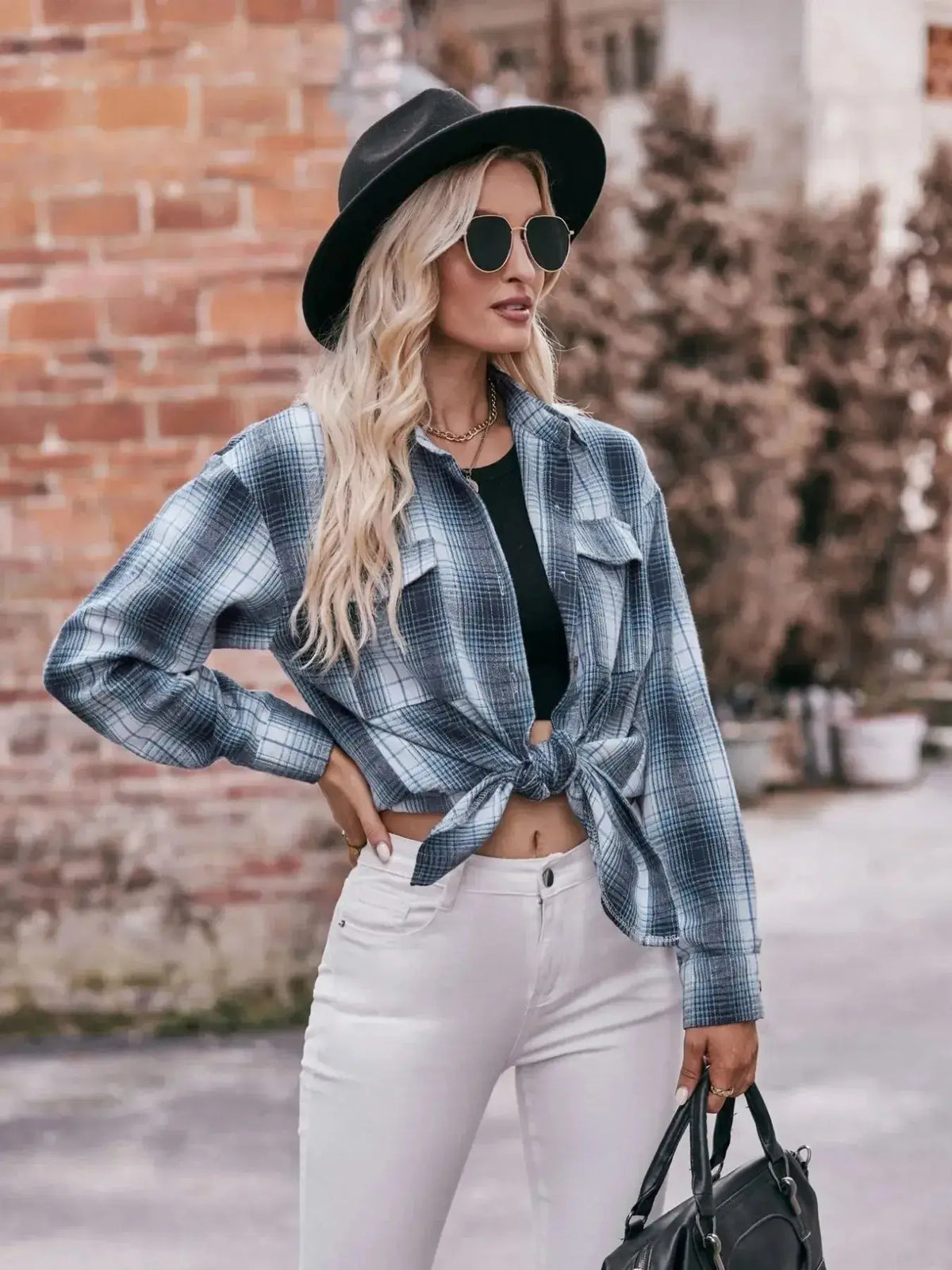 Women’s classic plaid long sleeve button-down shirt by Plush Fashion Hub, featuring a timeless pattern and relaxed fit.