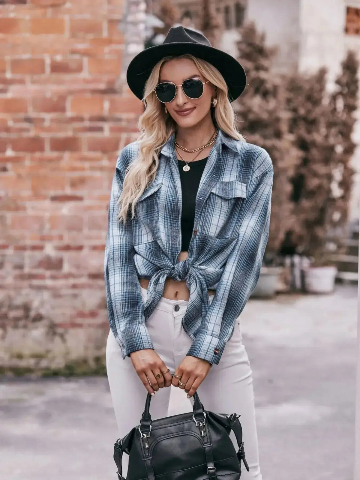 Women’s classic plaid long sleeve button-down shirt by Plush Fashion Hub, featuring a stylish and timeless plaid pattern.