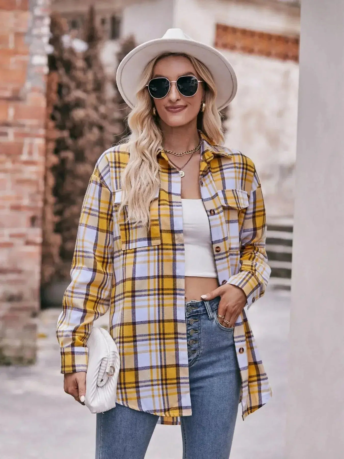 Women’s classic plaid long sleeve button-down shirt by Plush Fashion Hub, featuring a stylish and versatile design.