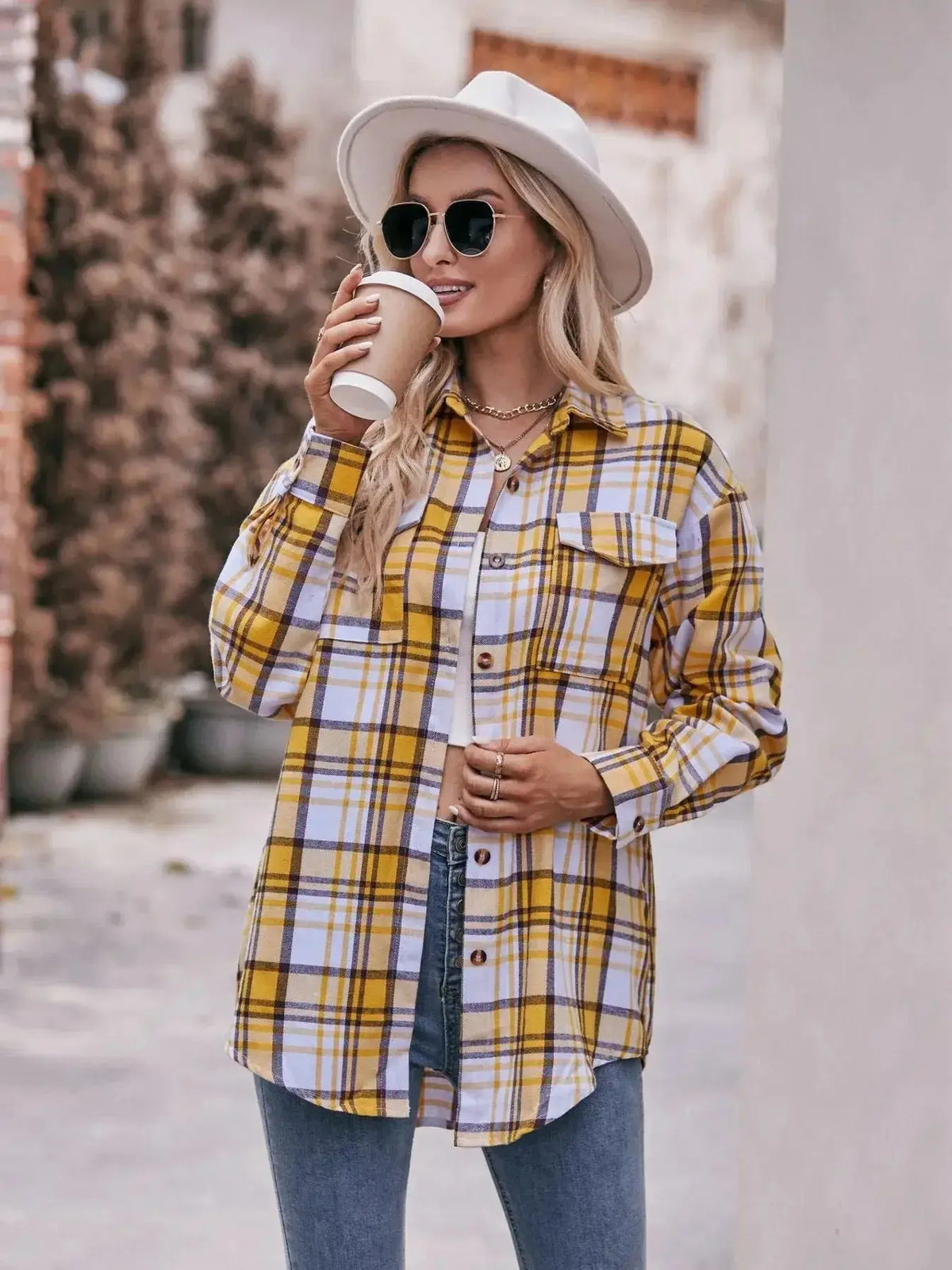 Women’s classic plaid long sleeve button-down shirt by Plush Fashion Hub, featuring traditional pattern and casual fit.