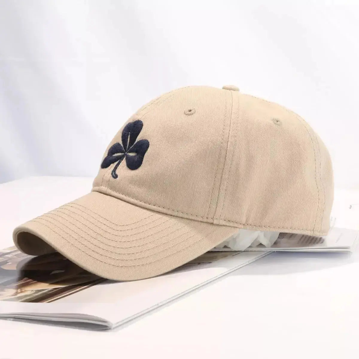 Clover embroidered 100% cotton baseball cap by Plush Fashion Hub, breathable casual hat with adjustable strap and stylish design.