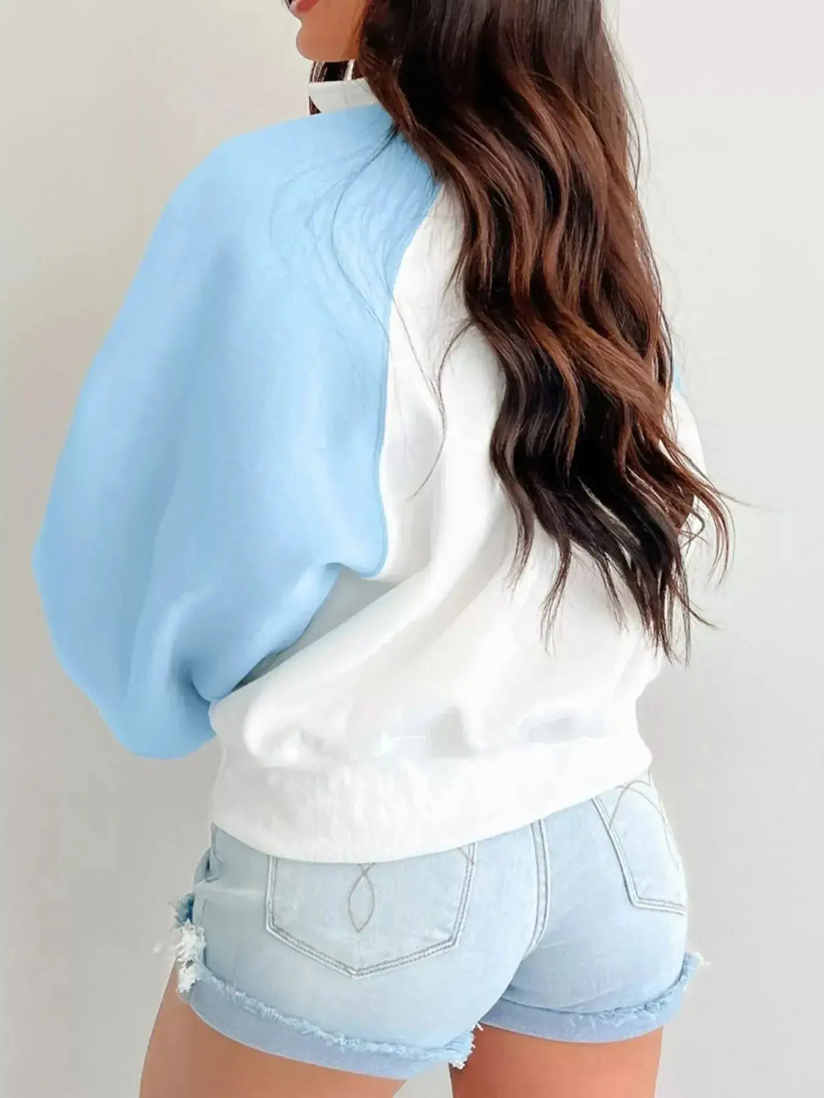 Women's color block sweatshirt with snap buttons, soft cotton blend pullover by Plush Fashion Hub, casual and stylish for everyday wear.