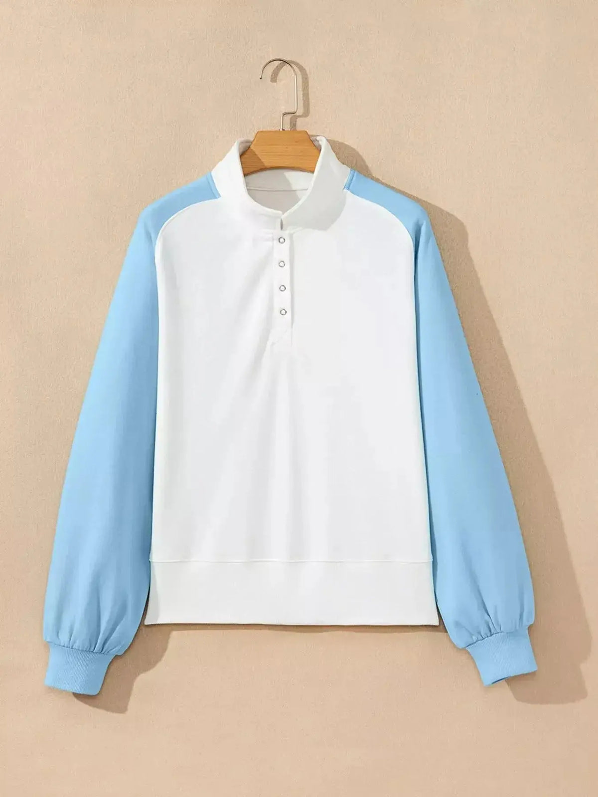 Women's color block snap button sweatshirt from Plush Fashion Hub, soft cotton blend pullover with vibrant color panels and casual style.