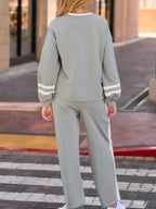 Contrast trim round neck lounge pants from Trendsi, cozy two-piece set with matching top, ideal for comfortable casual wear.