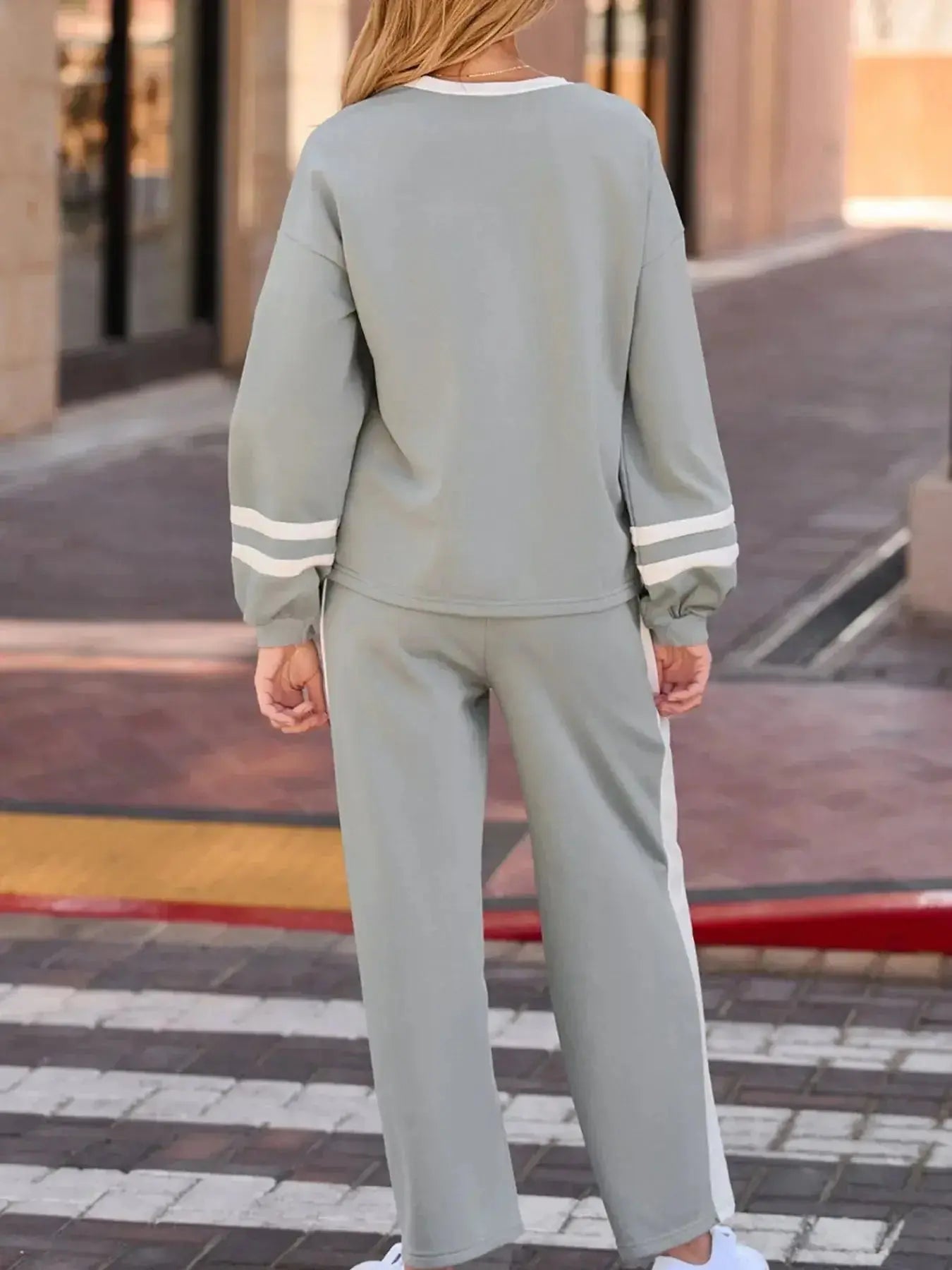 Contrast trim round neck lounge pants from Trendsi, cozy two-piece set with matching top, ideal for comfortable casual wear.