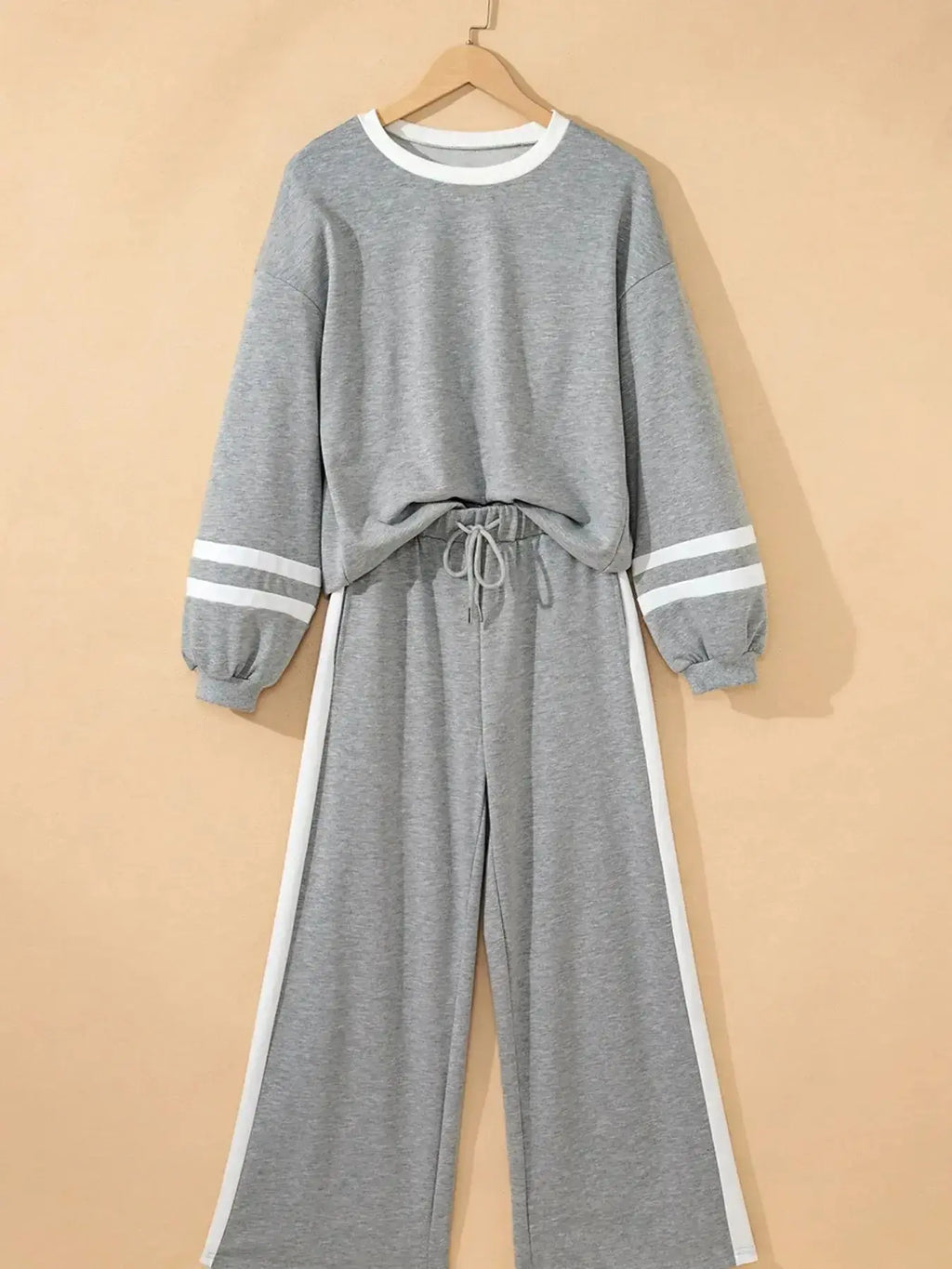 Contrast trim lounge pants from Trendsi, cozy two-piece set with round neck top and matching comfortable pants.