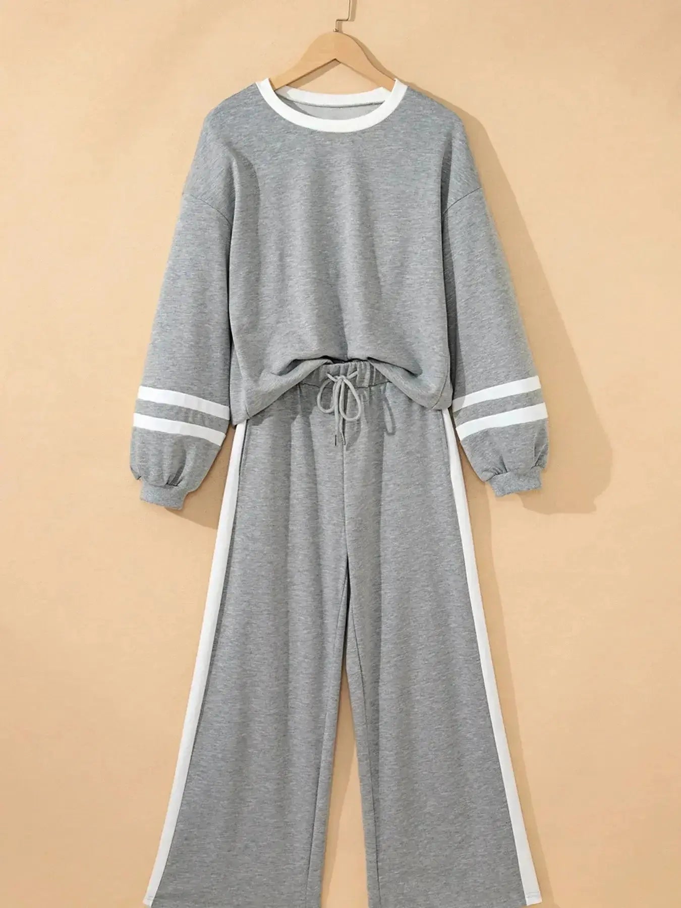 Contrast trim lounge pants from Trendsi, cozy two-piece set with round neck top and matching comfortable pants.