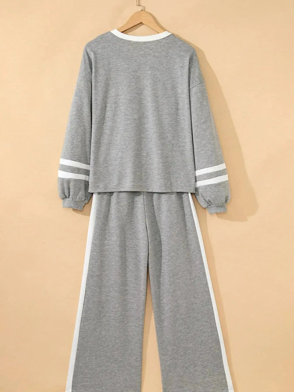 Contrast trim round neck lounge set by Trendsi, cozy two-piece pants and top in soft, comfortable fabric.