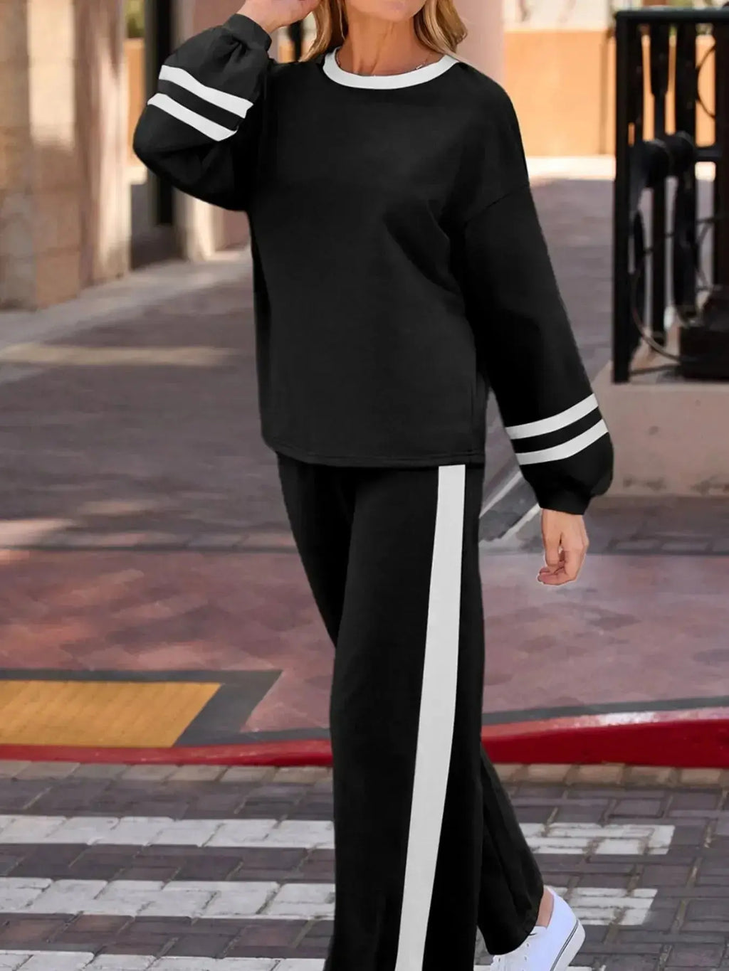 Contrast trim round neck lounge set by Trendsi featuring cozy two-piece top and pants with matching contrast details.