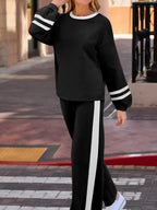 Contrast trim round neck lounge set by Trendsi featuring cozy two-piece top and pants with matching contrast details.