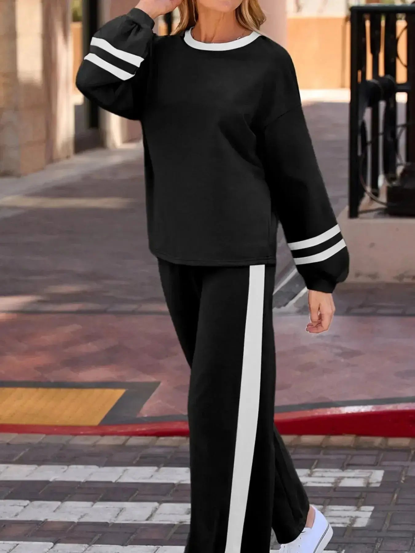 Contrast trim round neck lounge set by Trendsi featuring cozy two-piece top and pants with matching contrast details.