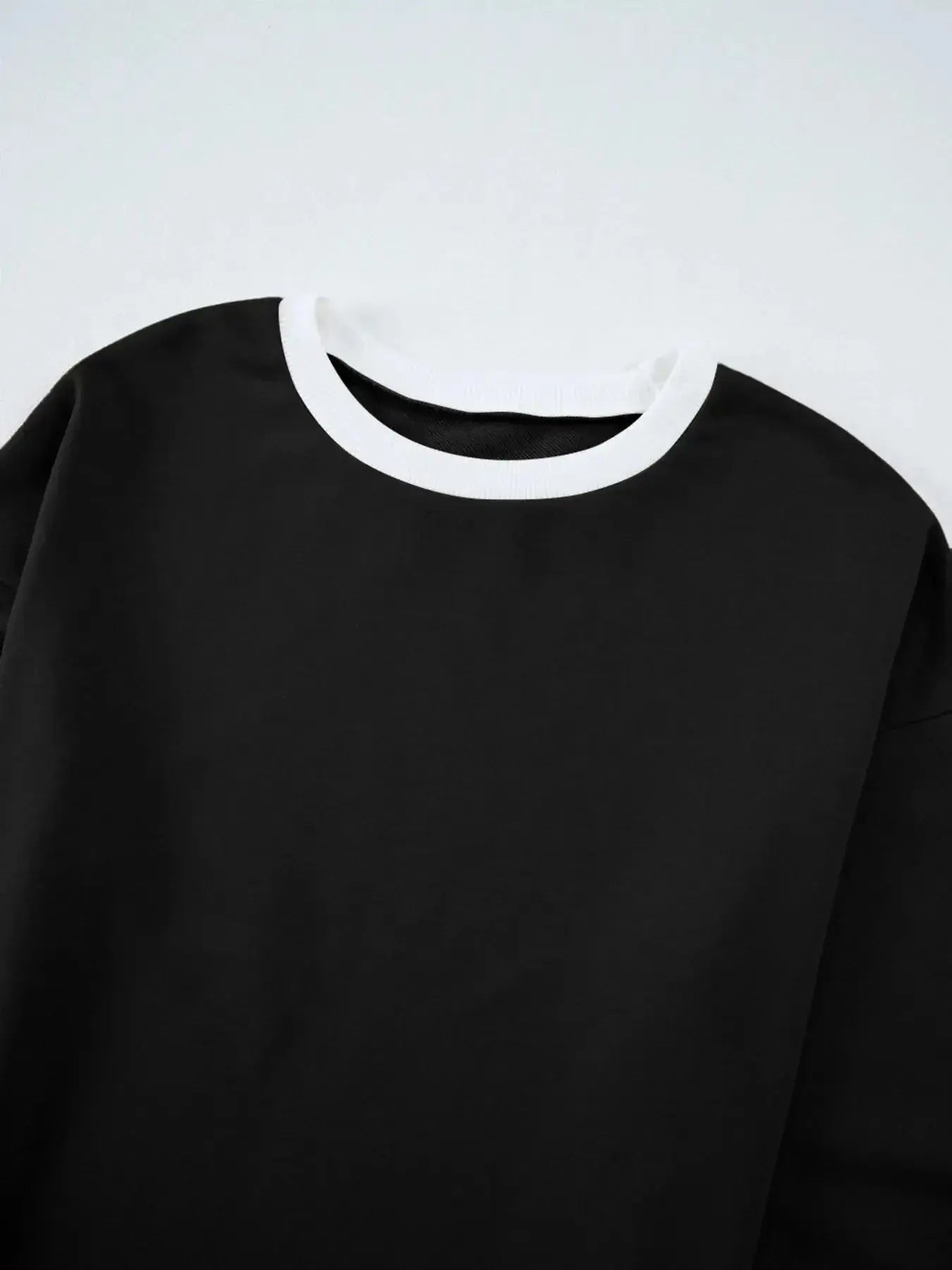 Contrast trim round neck lounge pants from Trendsi, cozy two-piece set with matching top and comfortable fit.