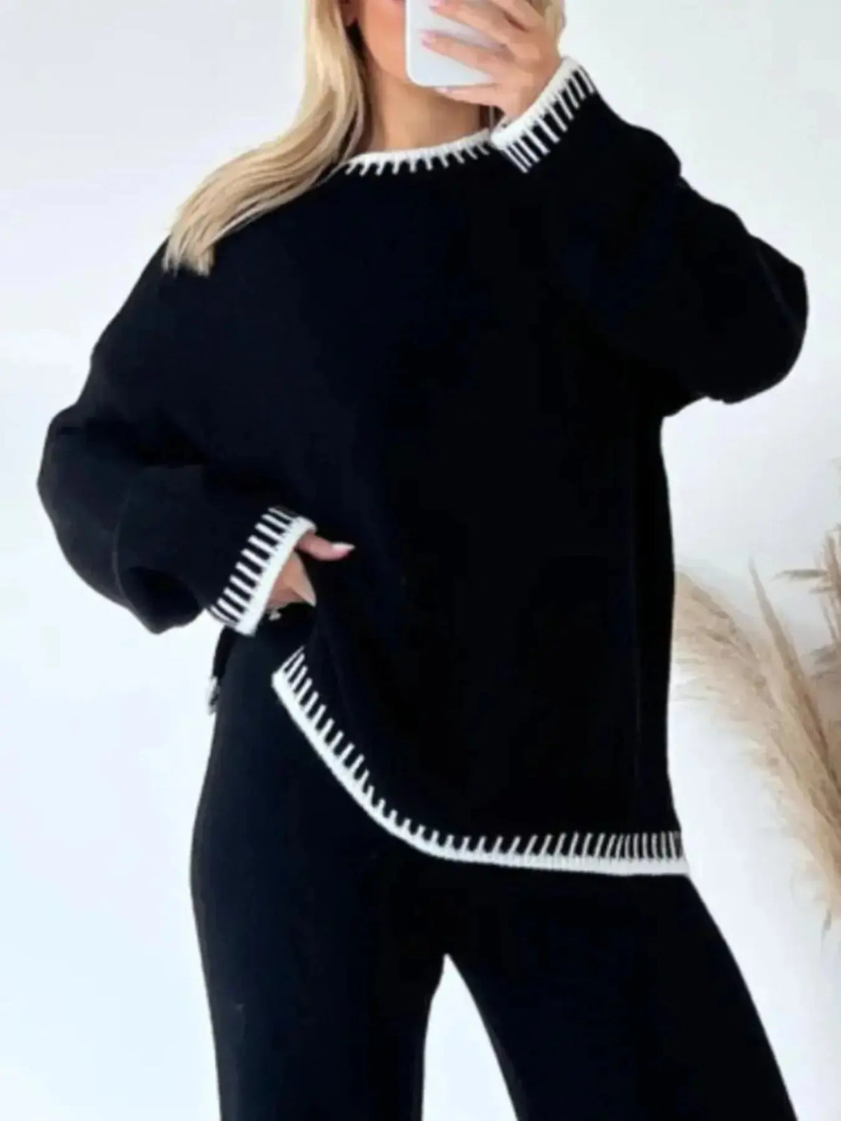 Plush Fashion Hub lounge set with contrast-trim round neck sweater top and wide-leg pants, cozy and stylish for relaxed wear.