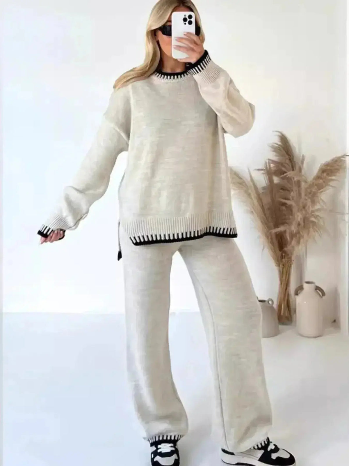 Plush Fashion Hub lounge set featuring a contrast trim round neck sweater top and wide-leg pants, perfect for casual comfort.