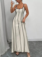 Flowy maxi dress with contrast trim, spaghetti straps, and ruched detailing, perfect for summer evening wear by Trendsi.