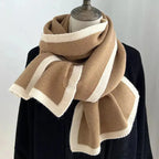 Soft plush winter scarf with modern contrast trim, cold weather accessory from Plush Fashion Hub.