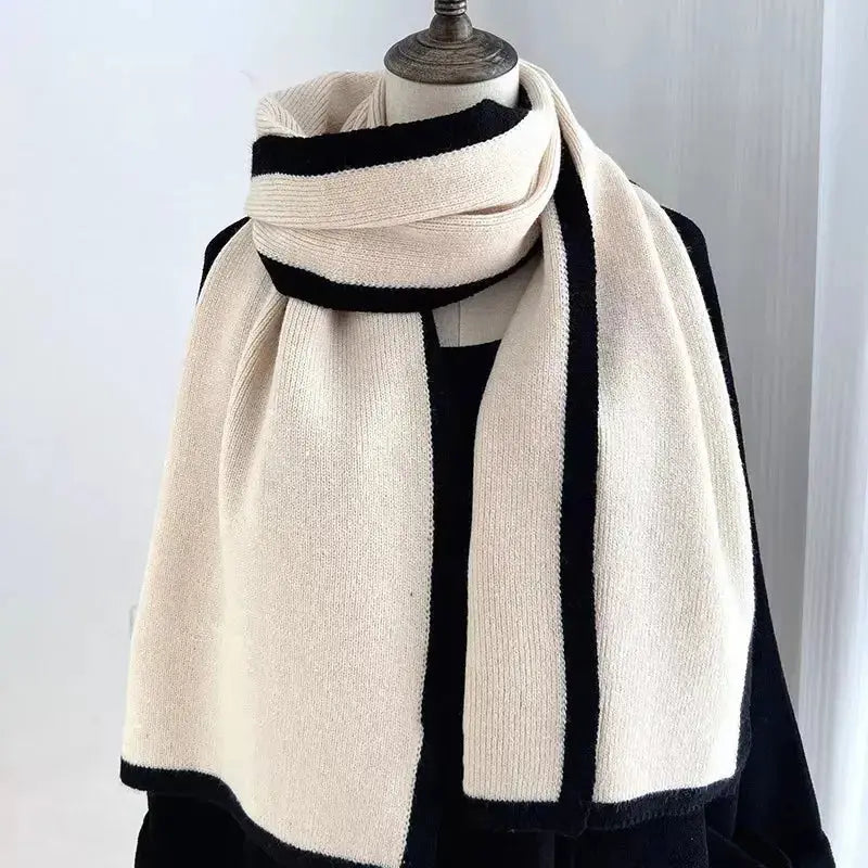Soft plush winter scarf with modern contrast trim, stylish cold weather accessory from Plush Fashion Hub.