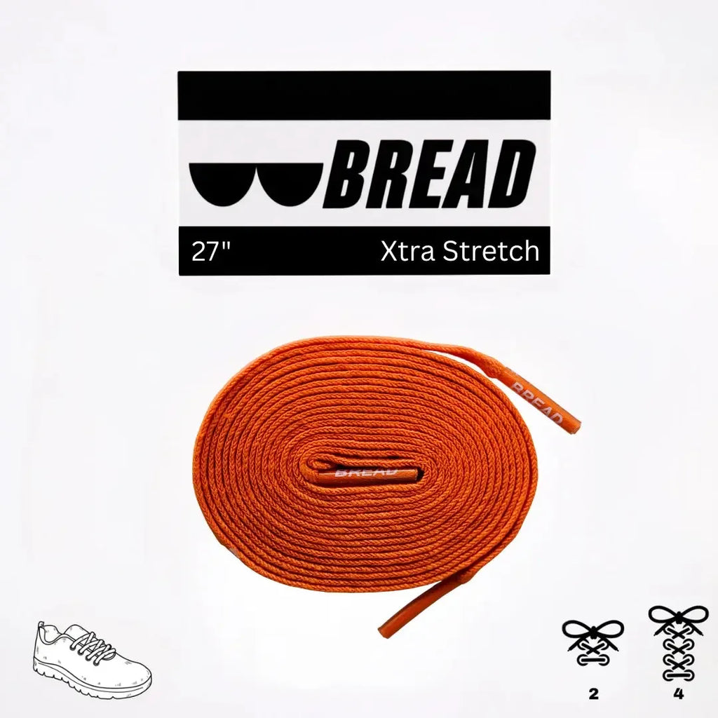 Coral orange elastic shoelace by Bread, shown in close-up with flexible, stretchable material and vibrant color.