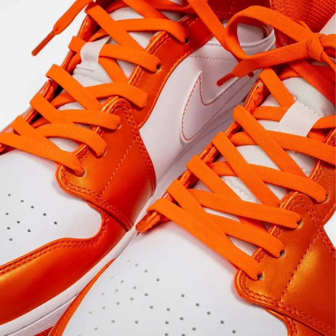 Coral orange elastic shoelace by Bread, showing a close-up of the flexible, colorful shoelace on a plain background.