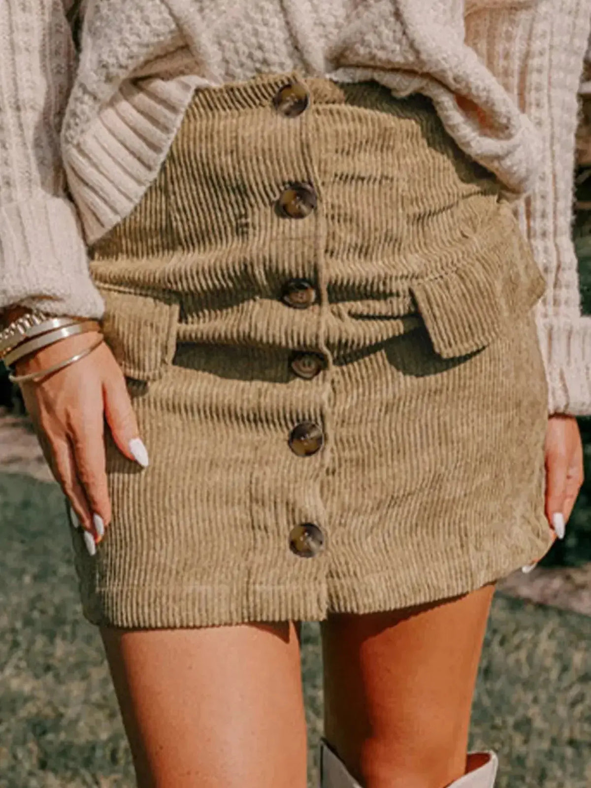 Women’s high-waisted corduroy mini skirt with front buttons, in a stylish design by Plush Fashion Hub.