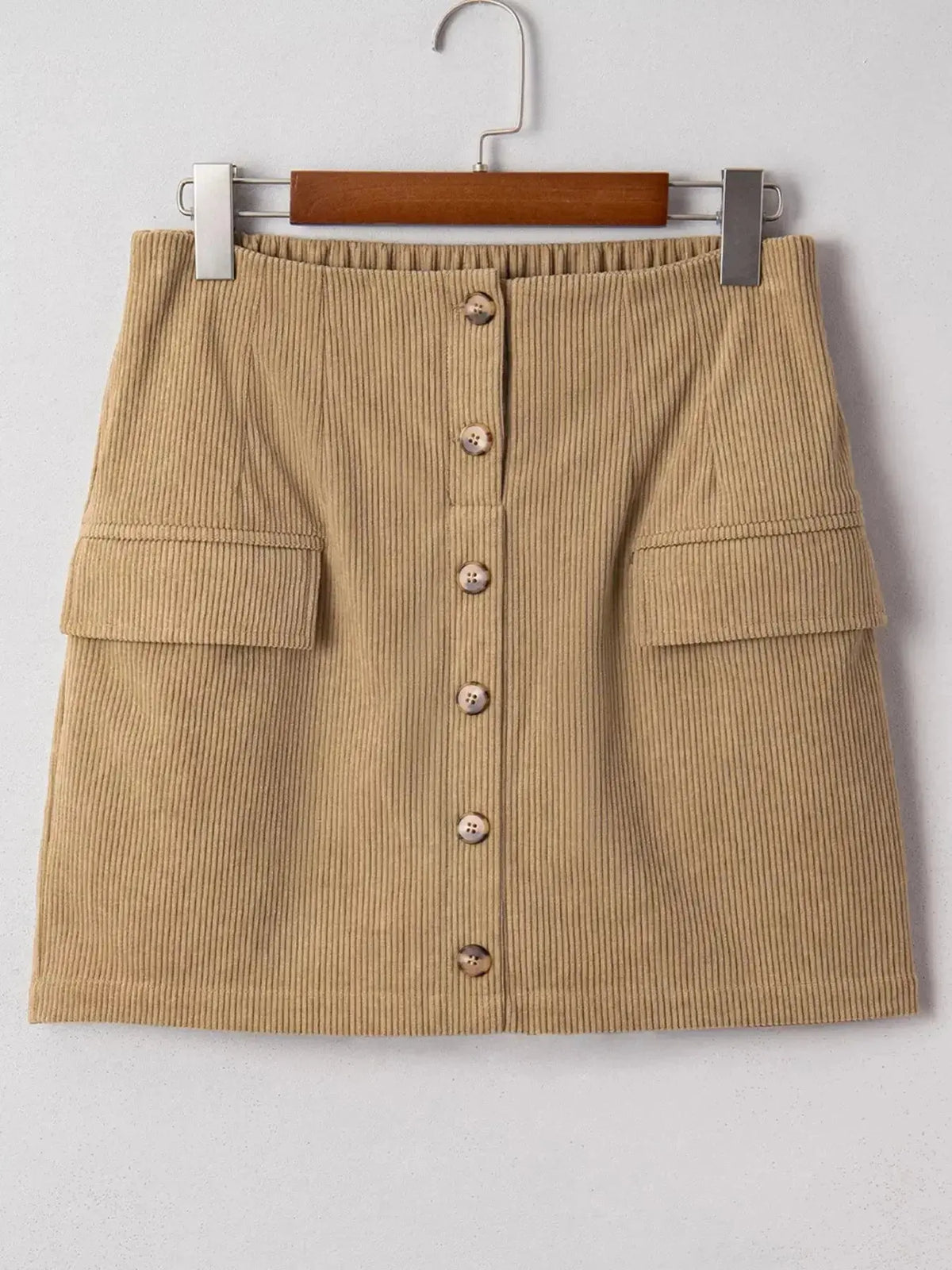 Women’s high-waisted corduroy mini skirt with button-front closure, in a rich texture, from Plush Fashion Hub.