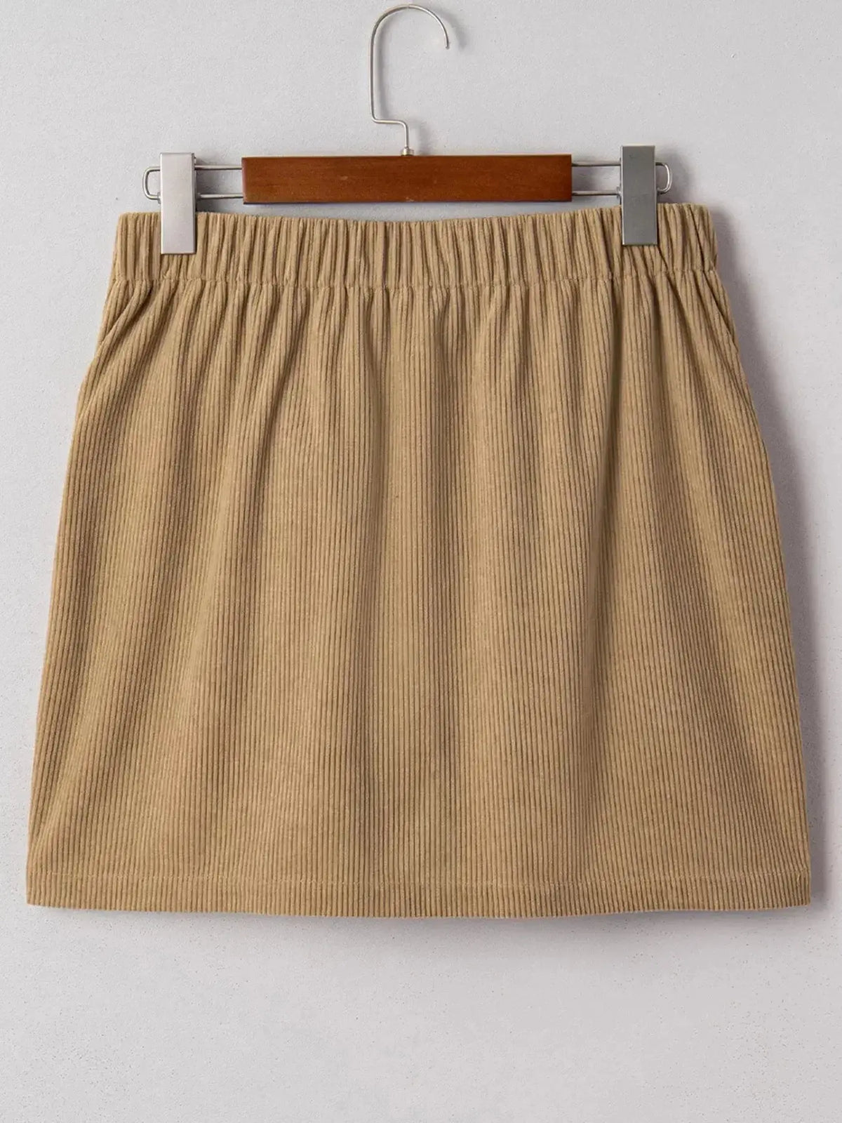 Women’s high-waisted corduroy mini skirt with button-front closure, from Plush Fashion Hub, shown in a stylish buttoned design.