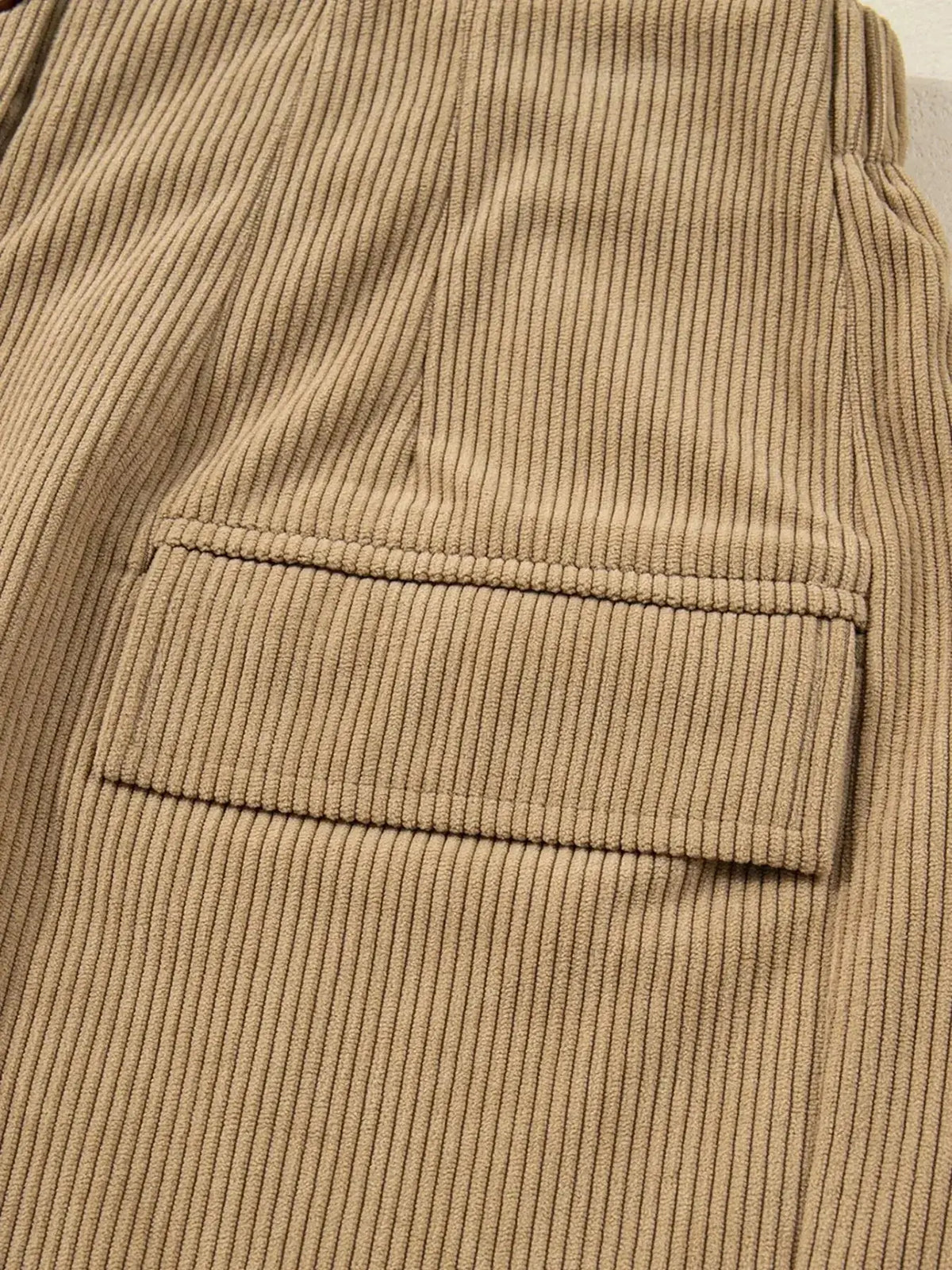 Women’s high-waisted corduroy mini skirt with button-front closure, stylish and trendy from Plush Fashion Hub.