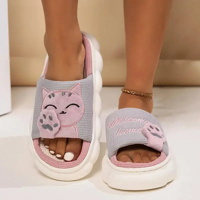 Soft pink cartoon kitten plush slippers for women, cozy indoor footwear with cute feline design by Plush Fashion Hub